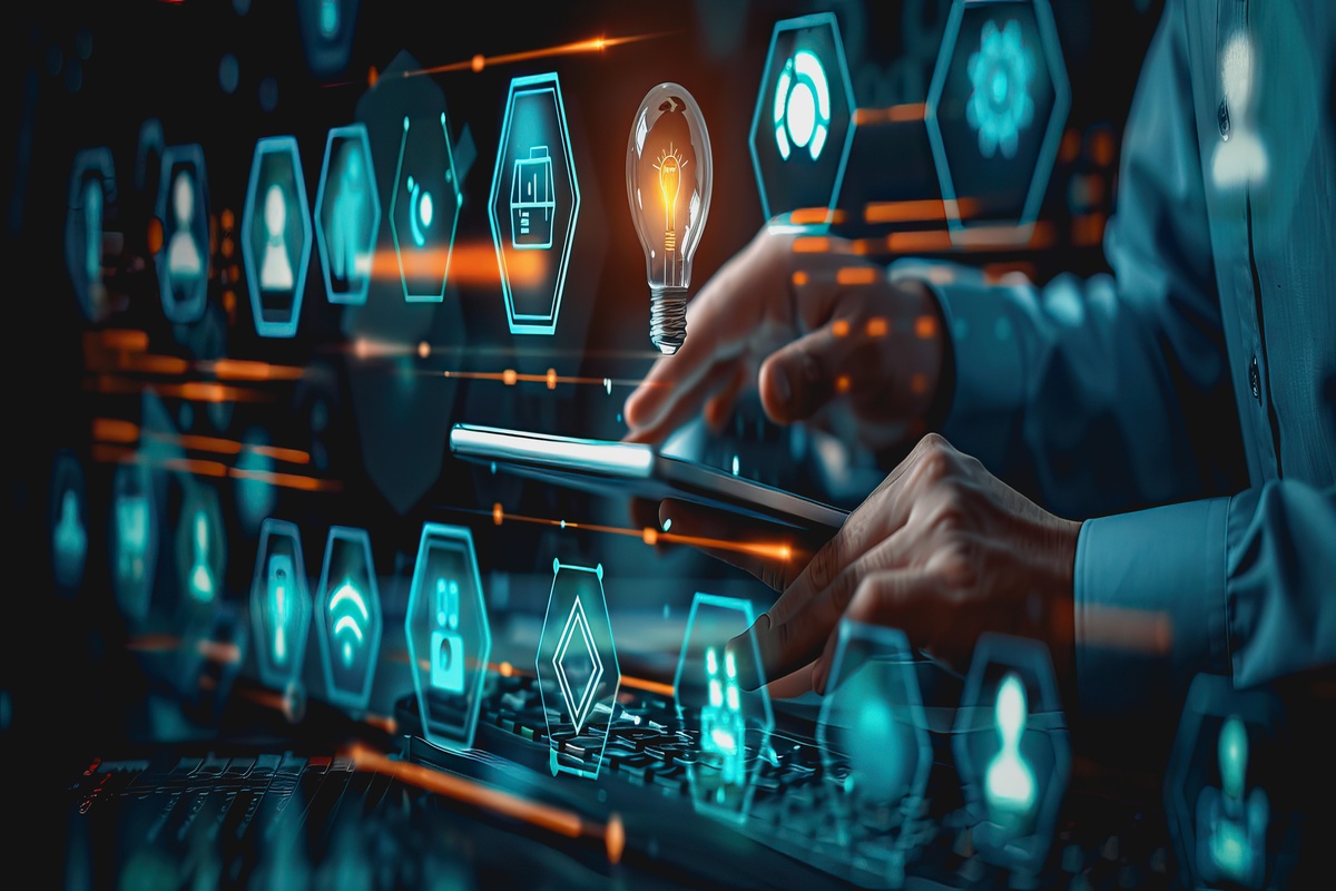 Man working on computer and tablet